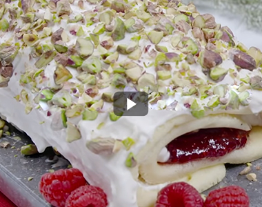 Christmas log, lemon, raspberries and pistachios