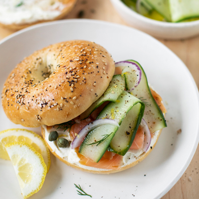 Smoked salmon bagel with marinated cucumbers