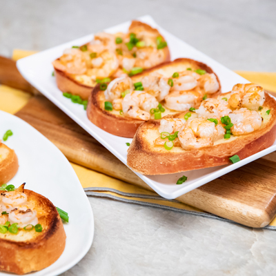 Grilled shrimp on garlic bread toasts