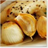 Unpeeled Garlic Bulbs on the Barbecue