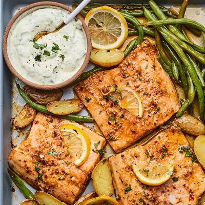 Lemony Sheet-pan Trout, Potatoes & Veggies with Garlic Herb Sauce