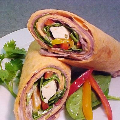 Wrap with roast beef, feta cheese and sun dried tomatoes